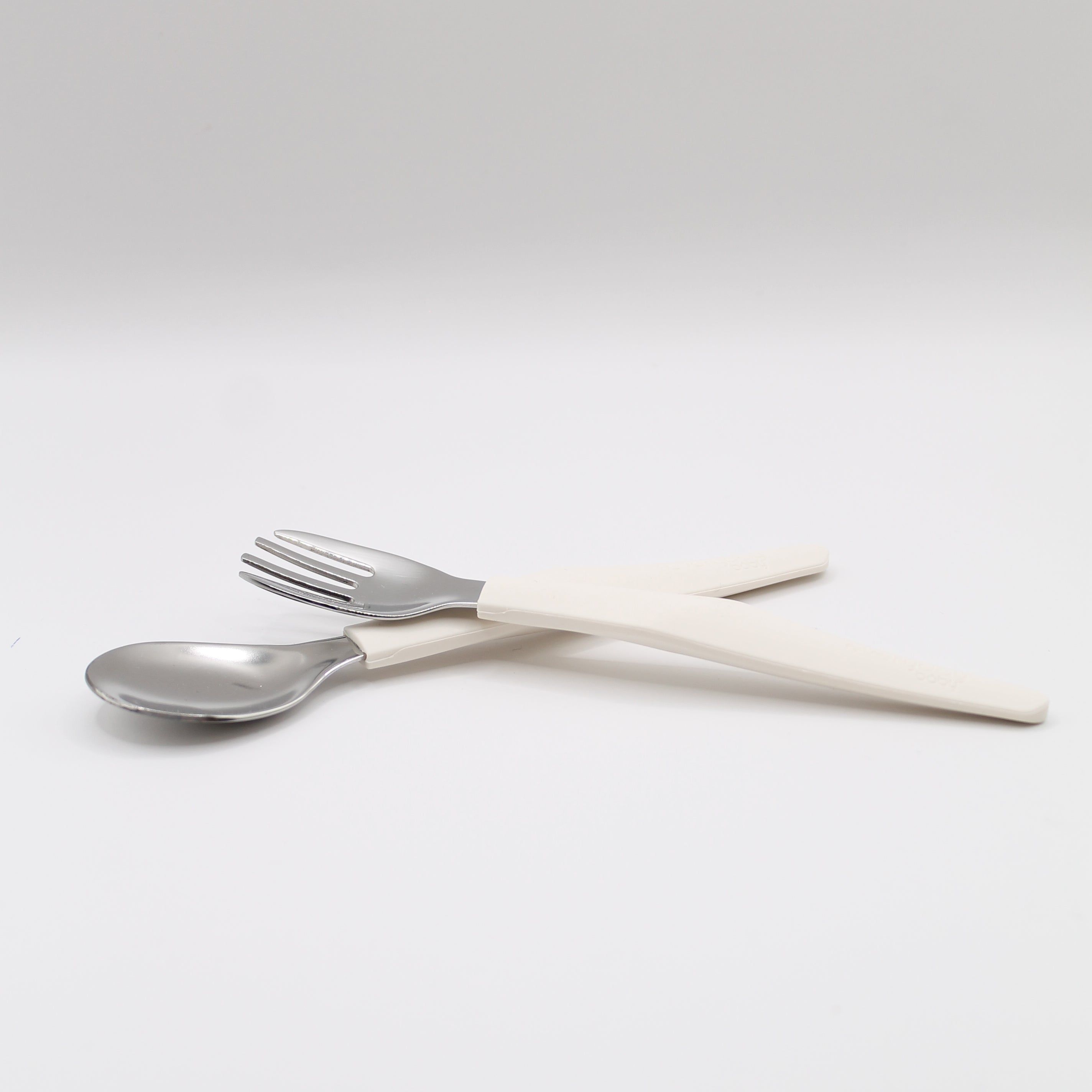 Children's cutlery in stainless steel and silicone